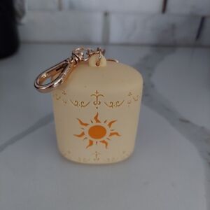 Rapunzel pocketback holder by bath and body works. IT'S MISSING THE HEART CHARM